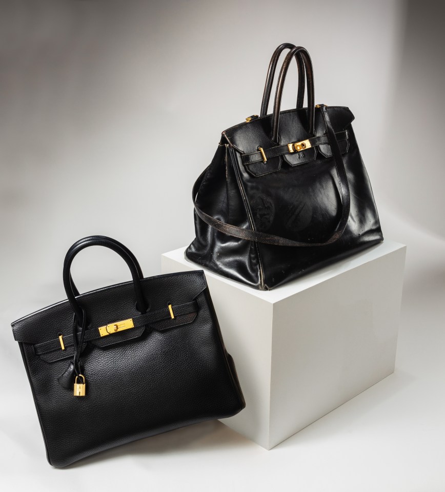 Two black Hermès Birkin handbags.