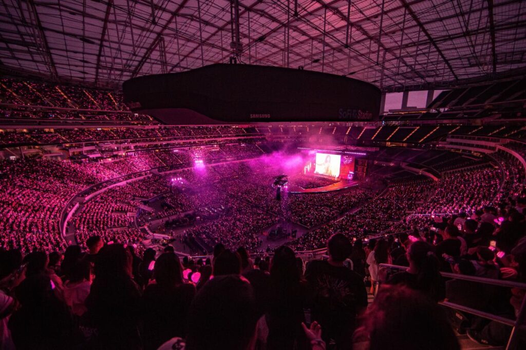 SoFi Stadium lights up pink for Blackpink's first U.S. concert in two years.