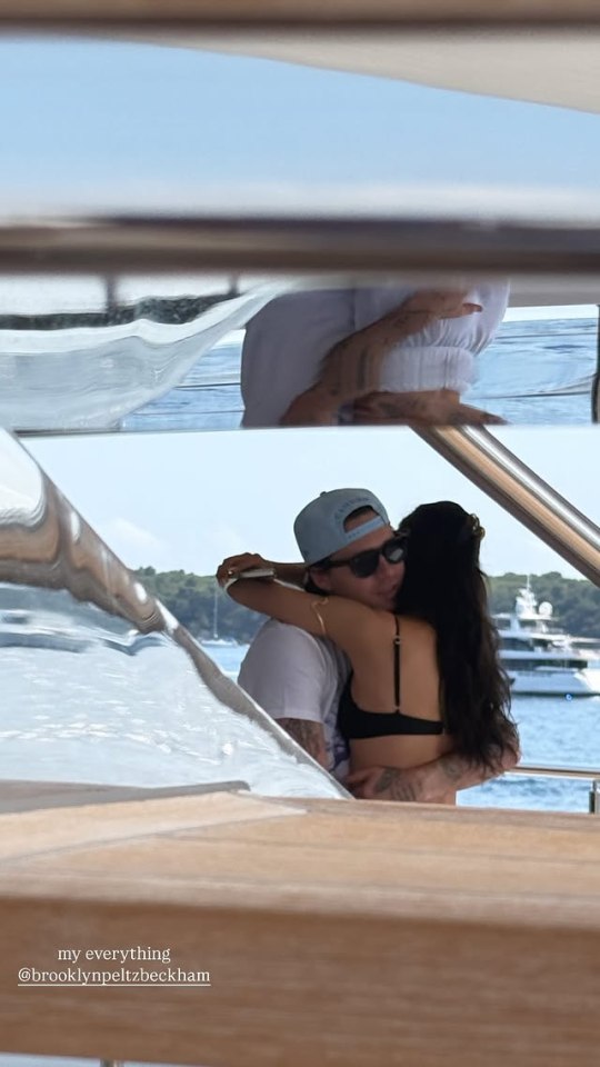 Couple hugging on a boat.
