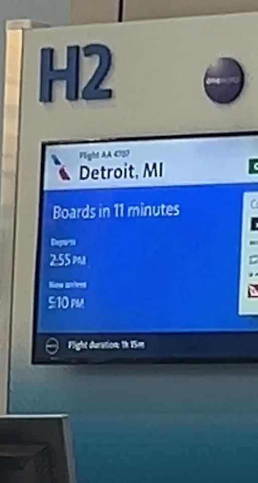 Airport departure board showing flight to Detroit boarding in 11 minutes.