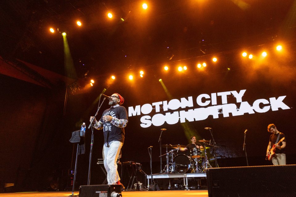 Motion City Soundtrack performing live on stage.