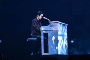Jin plays piano during his two-night run at Honda Center