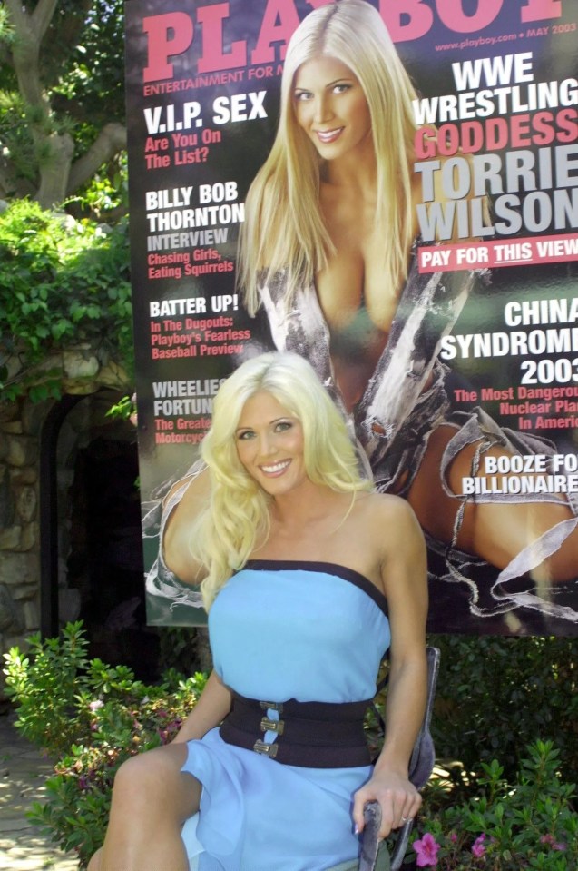 Torrie Wilson, WWE wrestler, posing with the May 2003 Playboy magazine featuring her.
