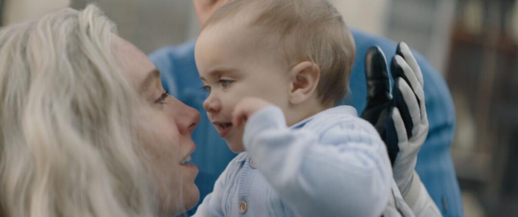 Vanessa Kirby's Sue Storm holds her baby in "The Fantastic Four: First Steps."