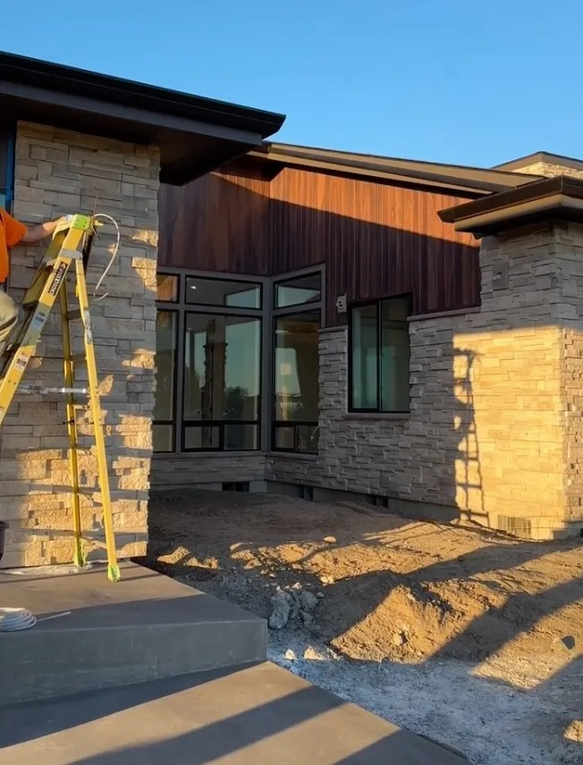 Exterior of a modern home under construction.