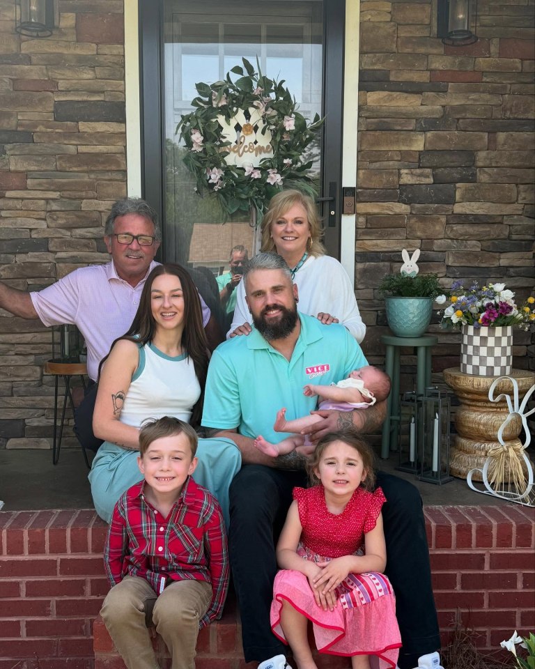 Family portrait on a porch.