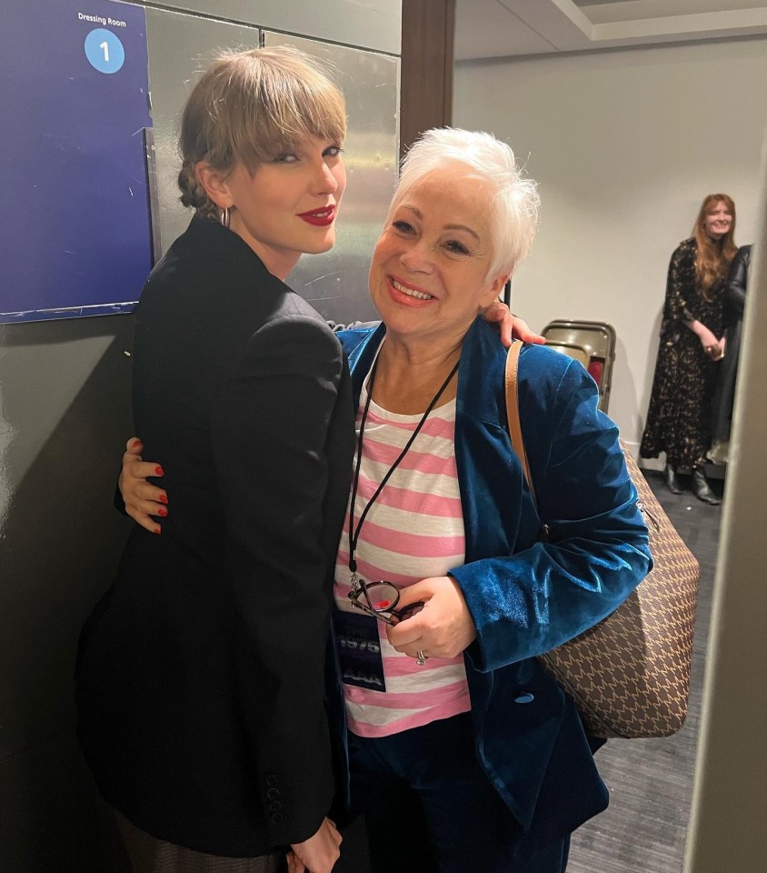 Taylor Swift hugging Denise Welch backstage.