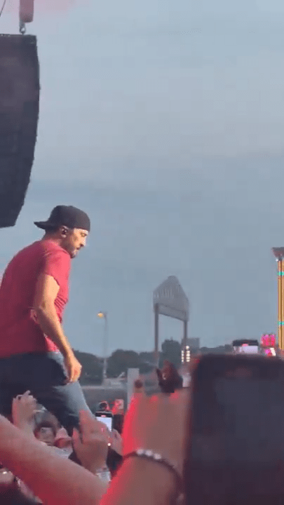 Luke Bryan performing on stage.