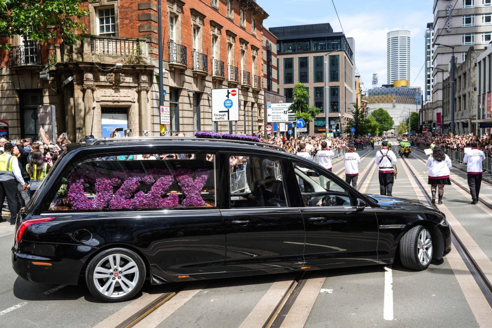 Ozzy Osbourne's funeral cortege moving through Birmingham city center.