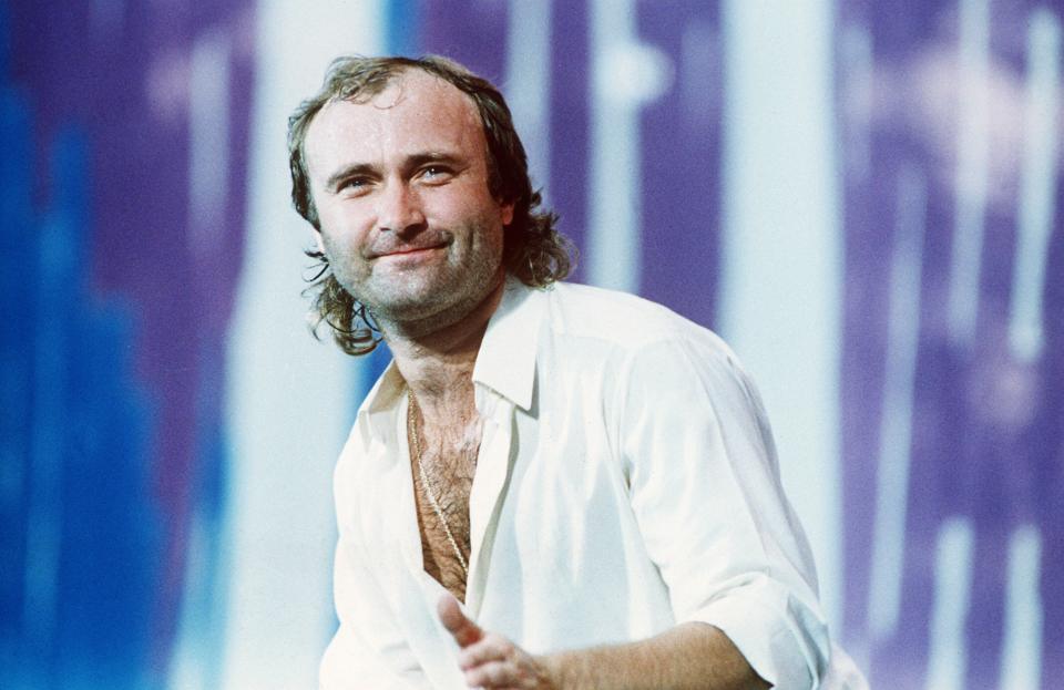 Phil Collins performing at Live Aid.