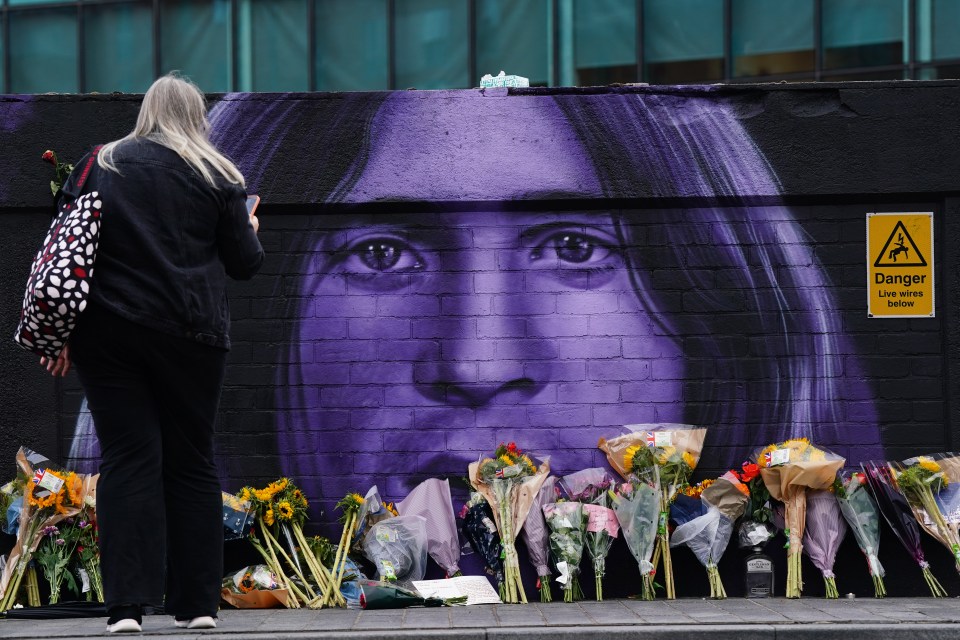 Floral tributes at a mural of Ozzy Osbourne.