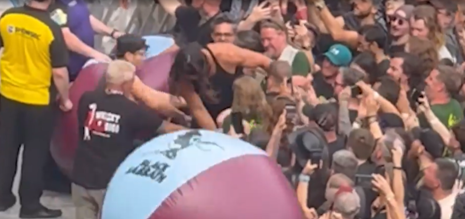 Jason Momoa in a mosh pit at a Black Sabbath concert.