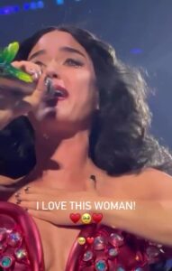 Katy Perry crying while singing onstage.