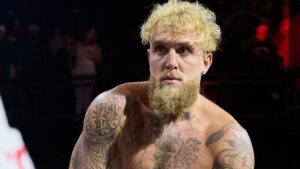 Jake Paul in boxing ring ducking punches