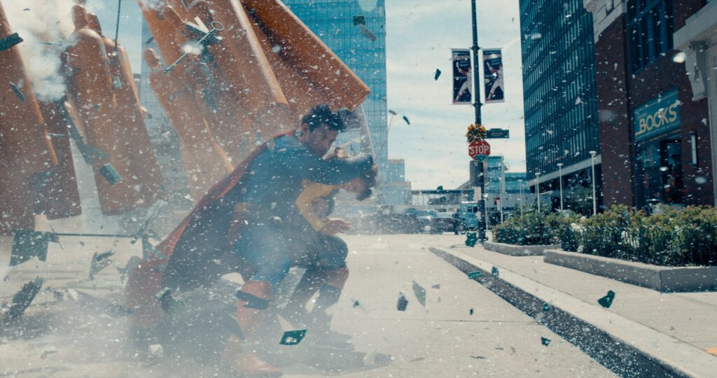 Superman saving a child from being crushed by pillars.