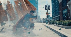Superman saving a child from being crushed by pillars.