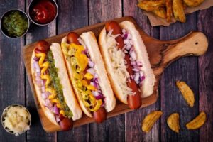 three hot dogs with different toppings
