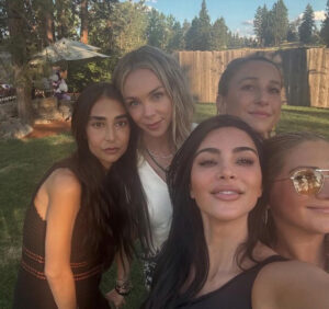 Group photo of five women at an outdoor birthday gathering.