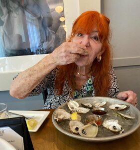 Sally Jessy Raphael eating oysters.