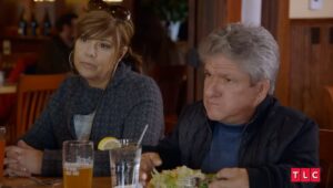 Matt Roloff and Caryn Chandler sitting at a restaurant table.