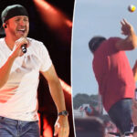 Luke Bryan reacts after getting hit in face with ball mid-show