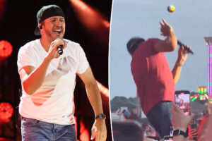 Luke Bryan reacts after getting hit in face with ball mid-show