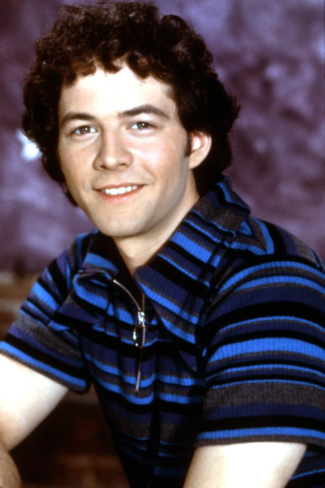 Christopher Daniel Barnes in a striped shirt.