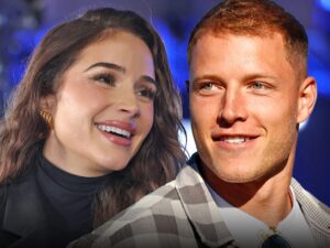 olivia culpo and christian mccaffrey smiling main getty