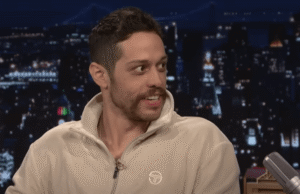 Pete Davidson on a talk show, discussing his girlfriend's pregnancy.