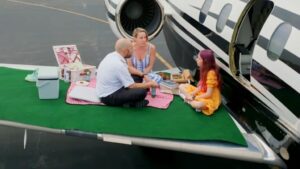 Armando sitting on a jet with his family MrBeast