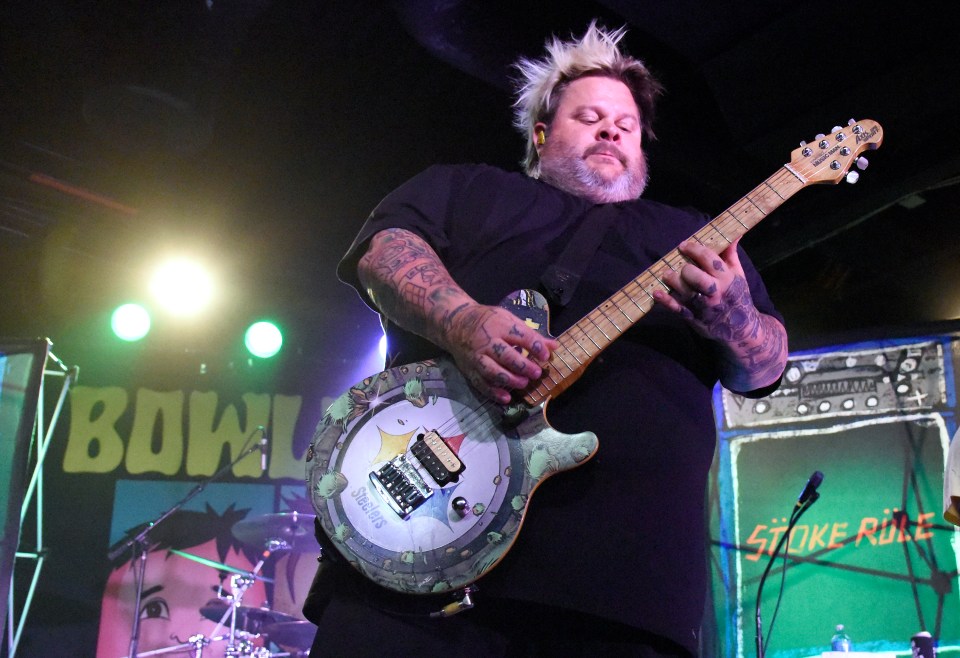 Jaret Reddick of Bowling for Soup performing on stage.