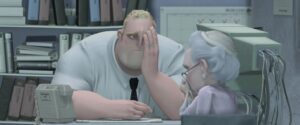 Bob Parr, aka Mister Incredible, sits in his grey office at a grey desk and looks grey, as a grey-haired elderly woman sits in the chair in front of him, crying, in The Incredibles