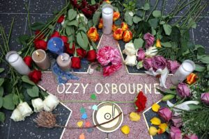 Flowers are left at a makeshift memorial at Ozzy Osbourne's Star on the Hollywood Walk of Fame on July 22, 2025, in Los Angeles.