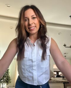 Mackenzie Edwards in a white shirt.