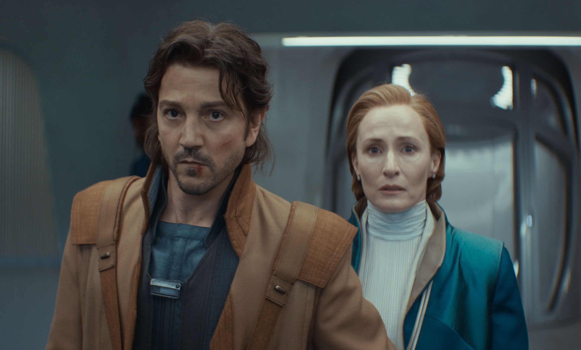 Cassian Andor (Diego Luna) and Mon Mothma (Genevieve O’Reilly) stand together in Andor season 2