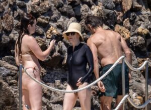 Julianne Moore, Bart Freundlich, and their daughter Liv Freundlich on a beach in Grosseto, Italy.