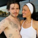 Nicola Peltz and Brooklyn Beckham embracing.