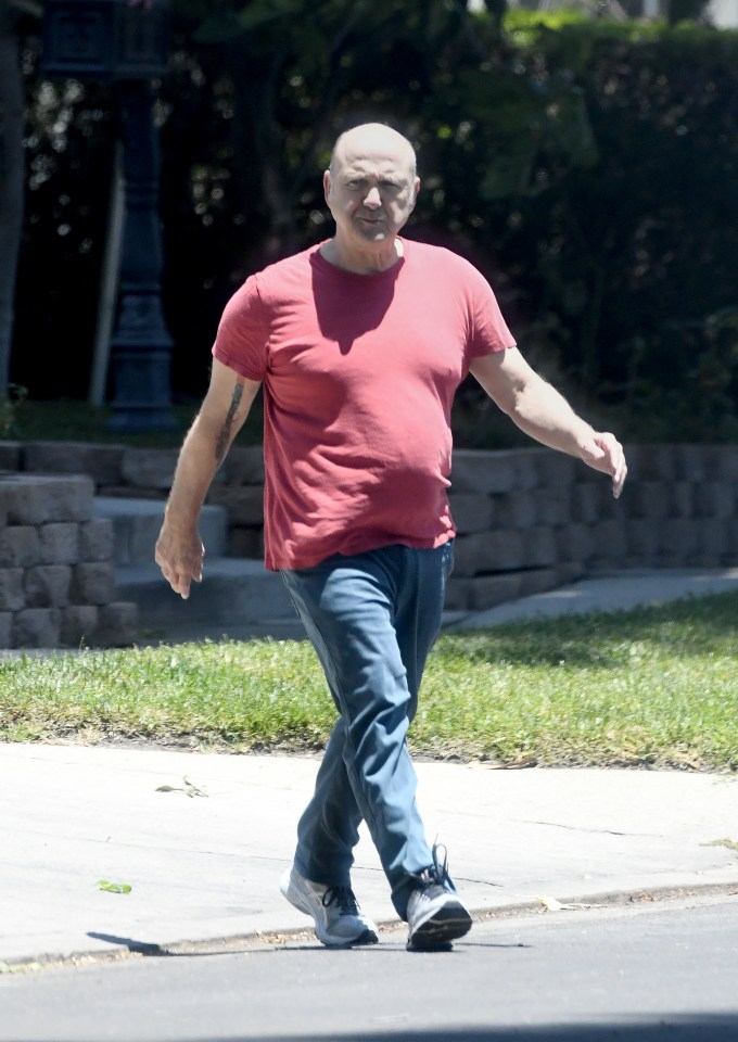 Paris Themmen, former child actor, walking down the street.