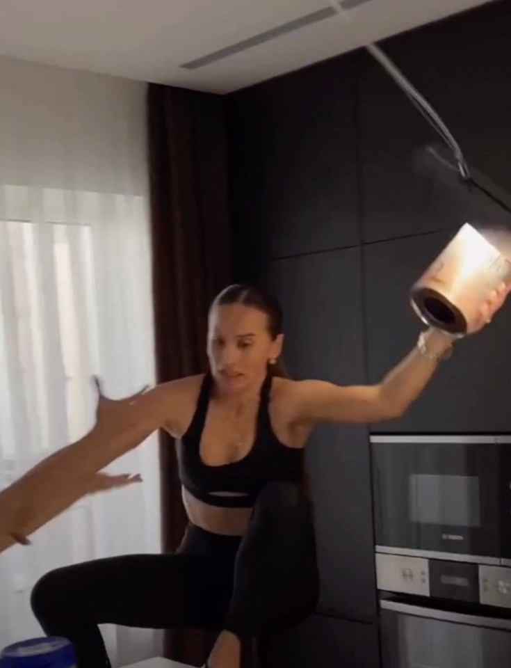 Woman failing a high-heel challenge, breaking her spine.