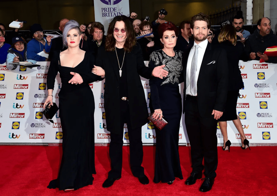 Ozzy and Sharon Osbourne with Kelly Osbourne and Jack Osbourne on a red carpet.