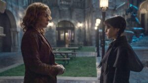 Billie Piper as Isadora Capri  stands in front of Wednesday in season two
