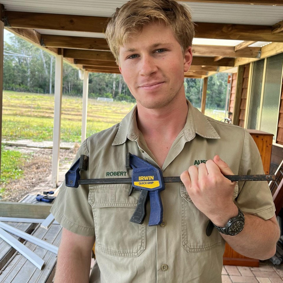 Robert Irwin holding a clamp.