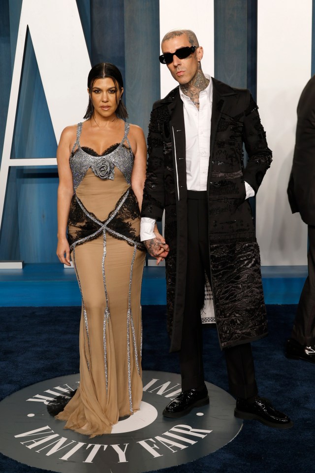 Kourtney Kardashian and Travis Barker at the Vanity Fair Oscar Party.