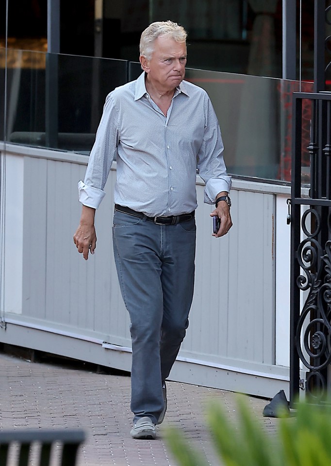 Pat Sajak walking outside.