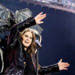 Ozzy Osbourne on stage in a bat-winged chair.