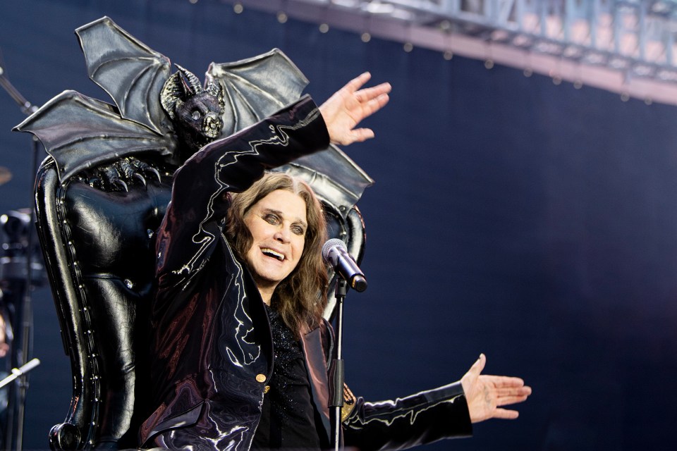 Ozzy Osbourne on stage in a bat-winged chair.