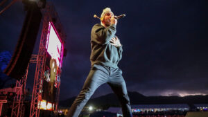 Adam Levine sings on stage with Maroon 5
