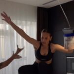 Woman attempting a high-heeled shoes challenge, falling.