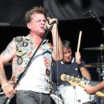 David Roach, singer of Junkyard, performing at a concert.