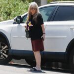Susan Olsen, former Brady Bunch child star, getting mail.